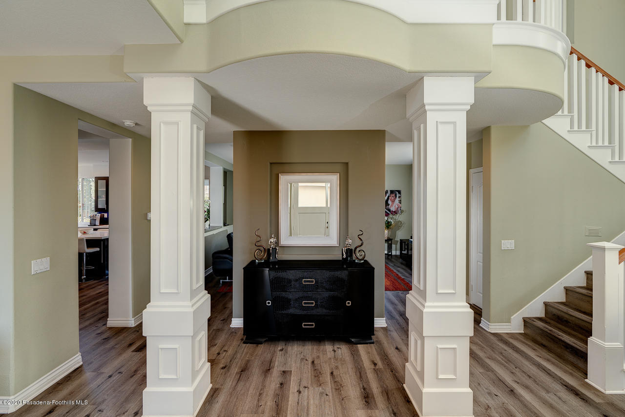 3683 Giddings Ranch Road Altadena, CA 91001 - Photo 3 of 30 a view of a hallway view with wooden floor and staircase