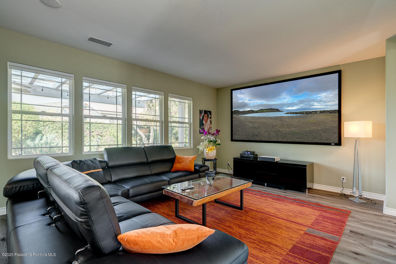 3683 Giddings Ranch Road Altadena, CA 91001 - Photo 8 of 30 a living room with furniture and a flat screen tv