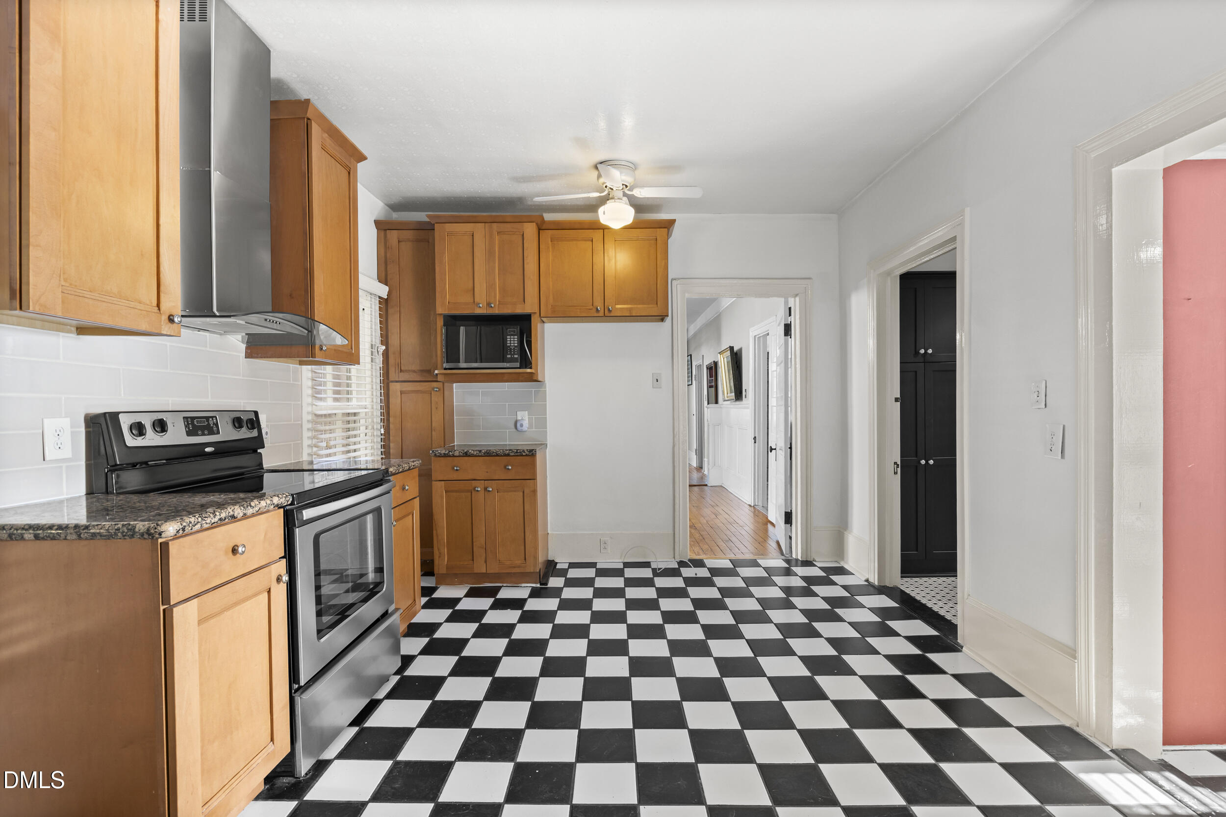 527 North East Street Raleigh, NC 27604 - Photo 17 of 46 a kitchen with stainless steel appliances granite countertop a refrigerator and a stove top oven