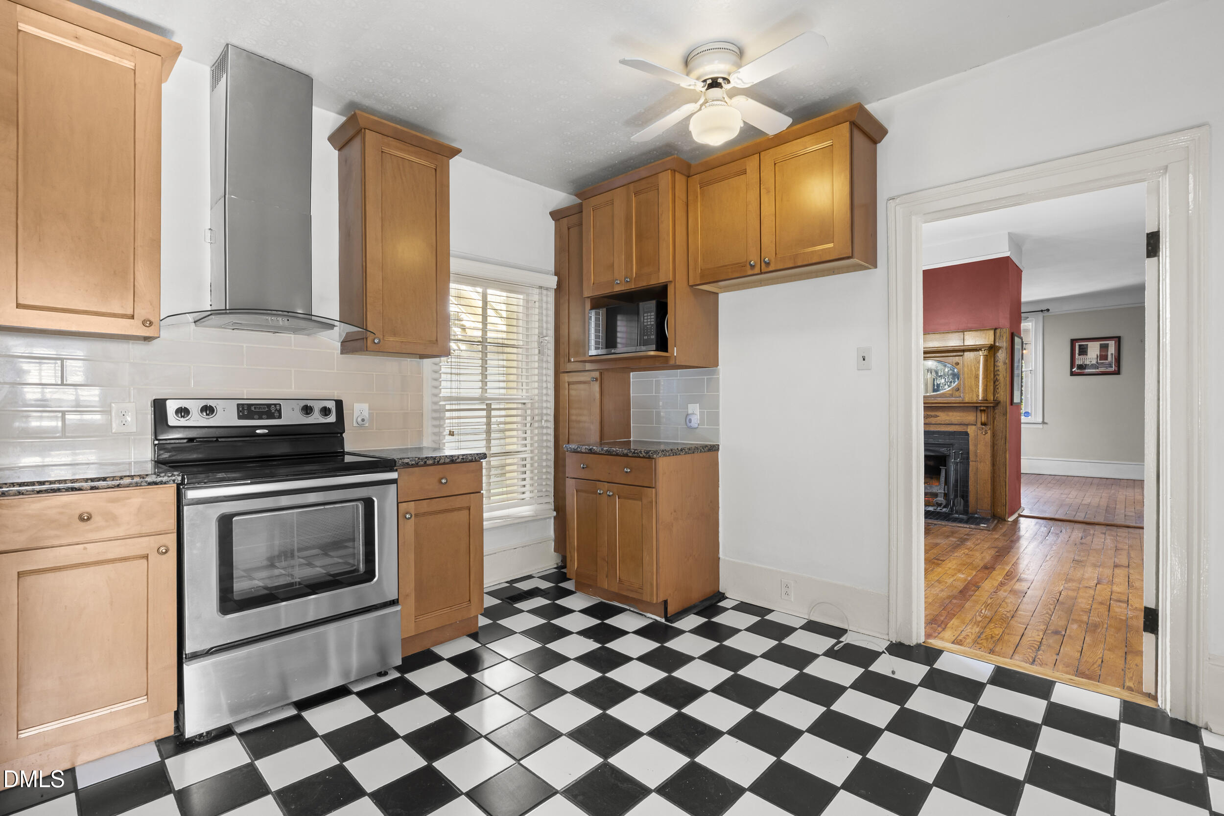 527 North East Street Raleigh, NC 27604 - Photo 18 of 46 a kitchen with stainless steel appliances granite countertop a refrigerator and a stove top oven