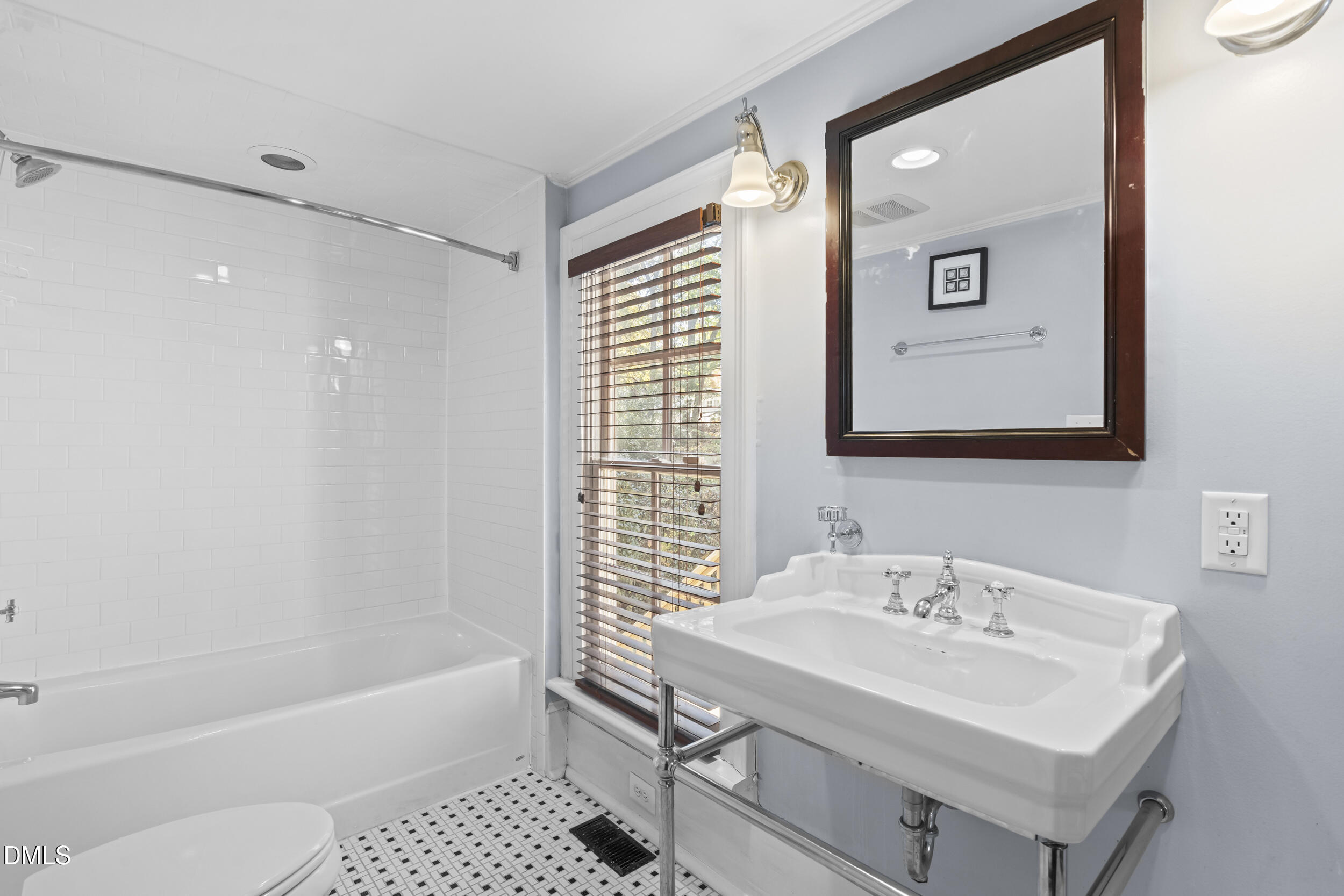 527 North East Street Raleigh, NC 27604 - Photo 19 of 46 a bathroom with a sink a toilet and shower