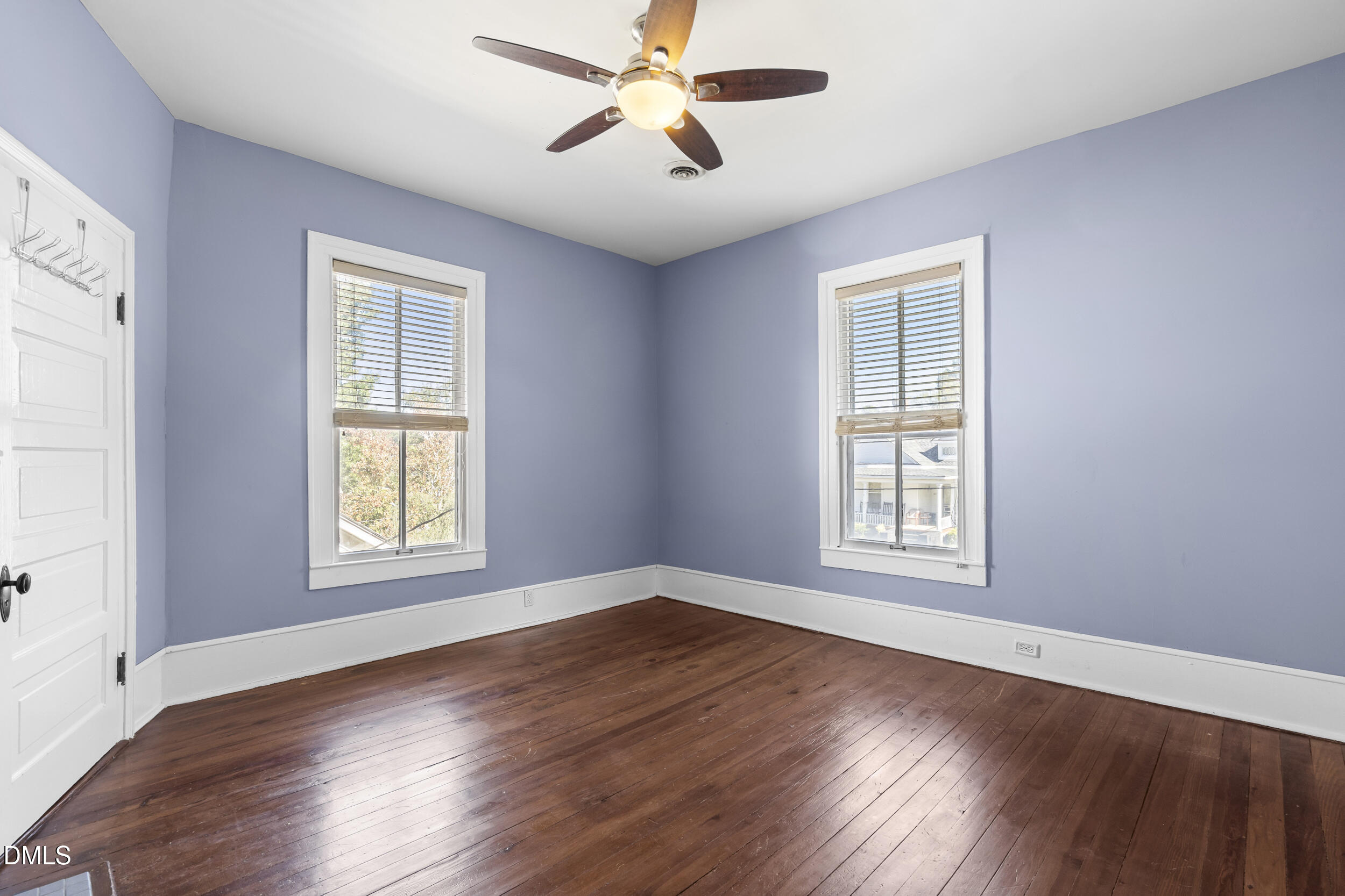 527 North East Street Raleigh, NC 27604 - Photo 25 of 46 a view of an empty room with wooden floor and a window