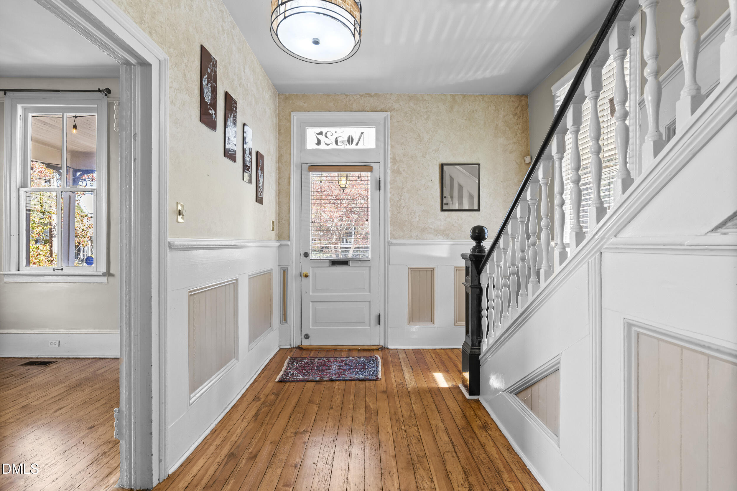 527 North East Street Raleigh, NC 27604 - Photo 7 of 46 a view of a hallway with wooden floor and staircase