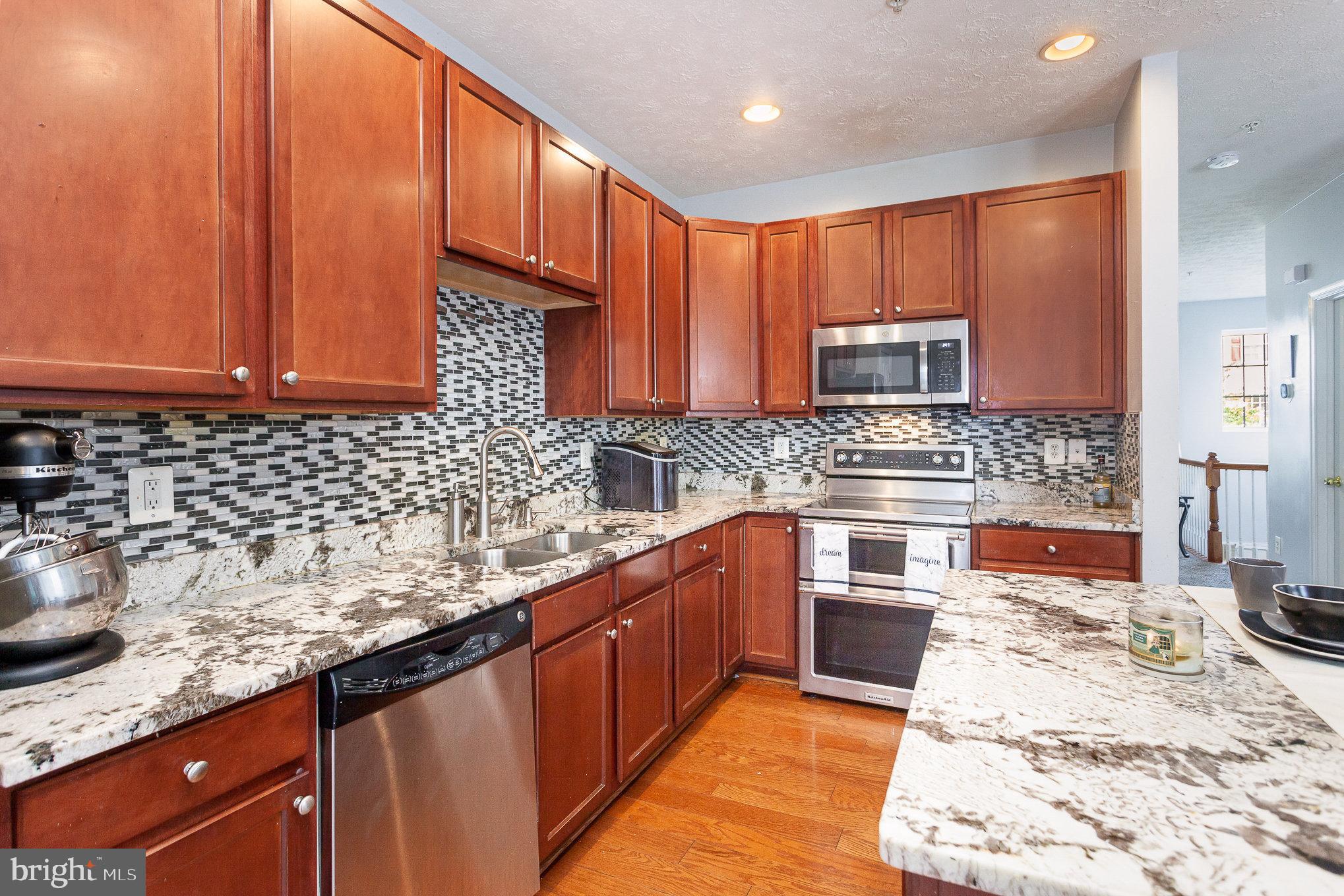 828 Lowe Road Middle River, MD 21220 - Photo 16 of 29 Granite Counters and Tile Backsplash