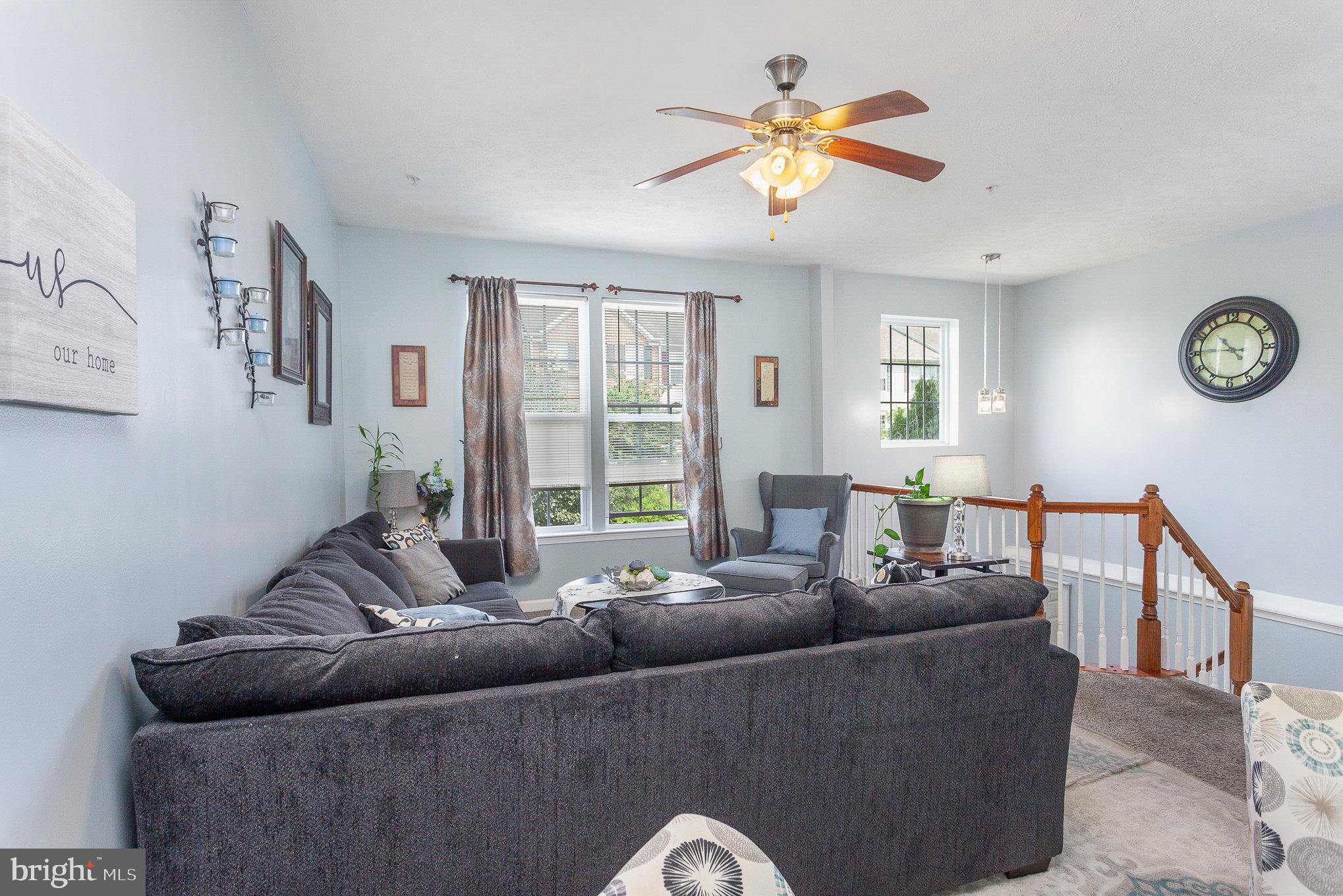 828 Lowe Road Middle River, MD 21220 - Photo 8 of 29 Upper Level 1 Living Room w Ceiling Fan and Carpet