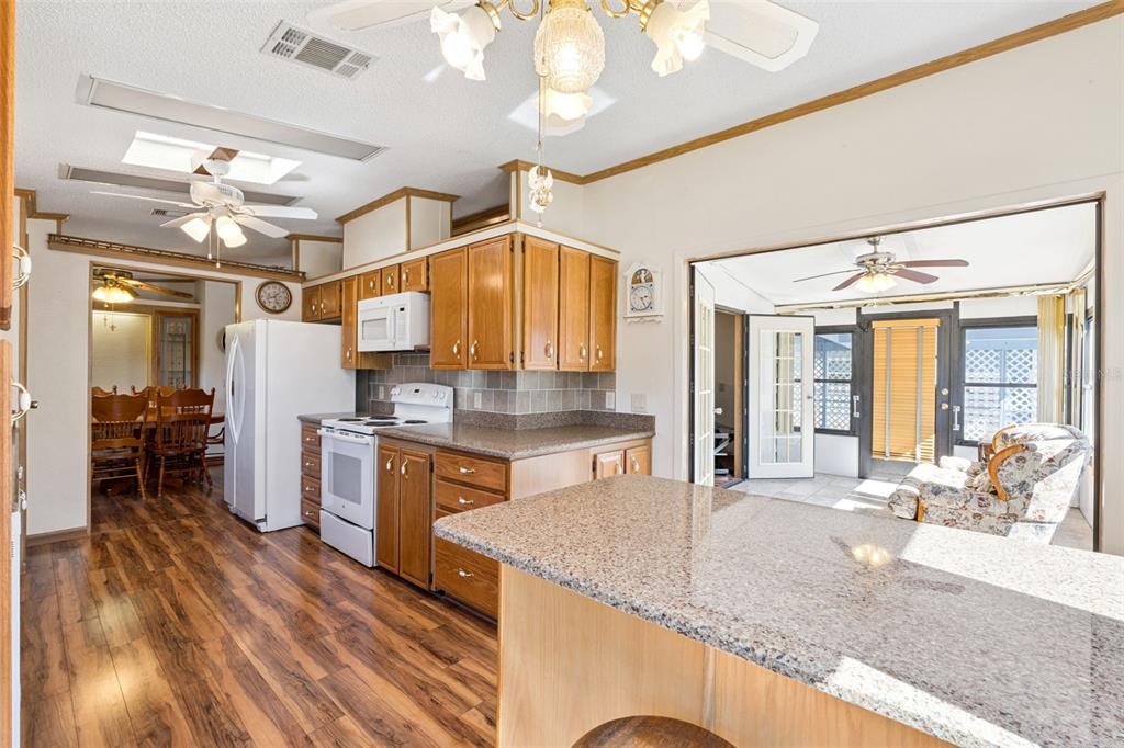 3122 Myakka River Road Tavares, FL 32778 - Photo 12 of 44 a kitchen with a sink appliances and cabinets