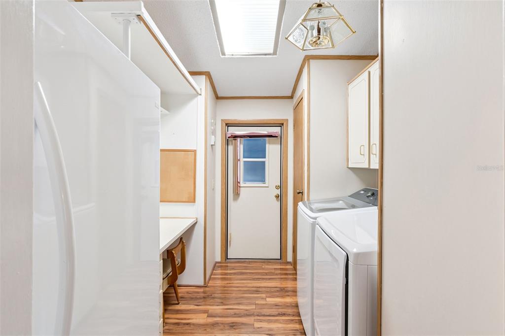 3122 Myakka River Road Tavares, FL 32778 - Photo 19 of 44 a view of hallway with wooden floor