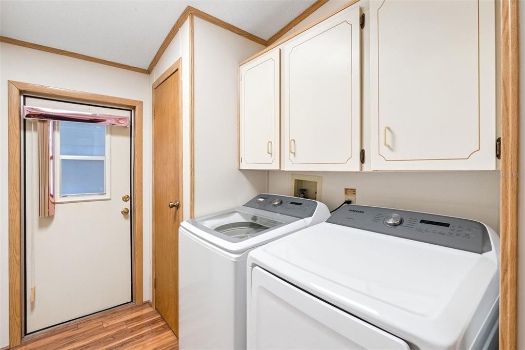 3122 Myakka River Road Tavares, FL 32778 - Photo 24 of 44 a utility room with dryer and washer