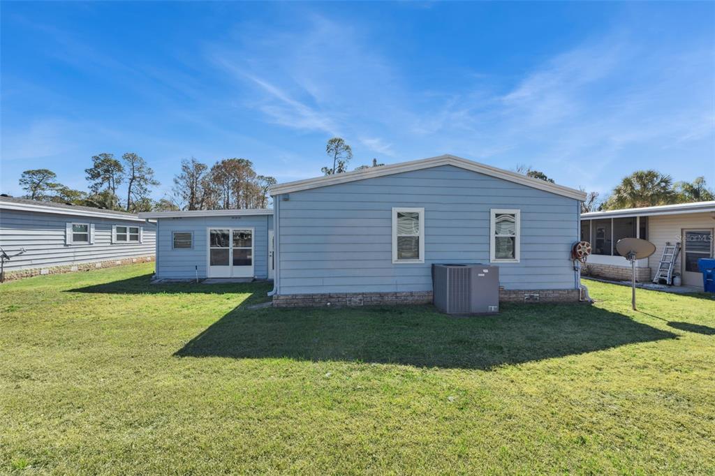 3122 Myakka River Road Tavares, FL 32778 - Photo 33 of 44 a view of a house with a backyard
