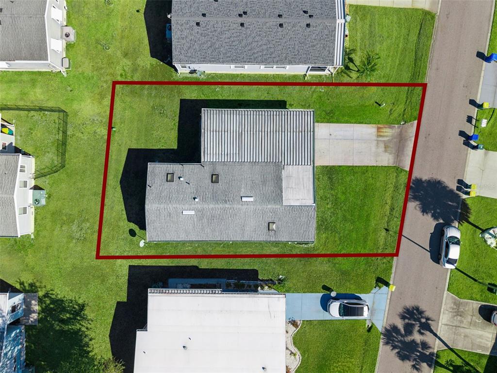 3122 Myakka River Road Tavares, FL 32778 - Photo 39 of 44 an aerial view of a house with a yard