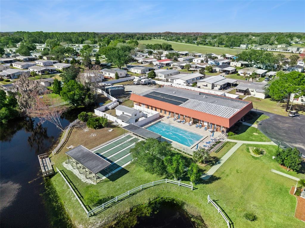 3122 Myakka River Road Tavares, FL 32778 - Photo 40 of 44 an aerial view of a house with a garden