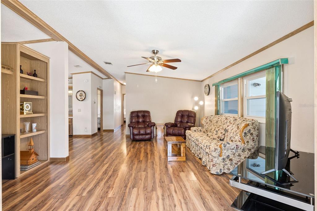 3122 Myakka River Road Tavares, FL 32778 - Photo 4 of 44 a living room with furniture and wooden floor