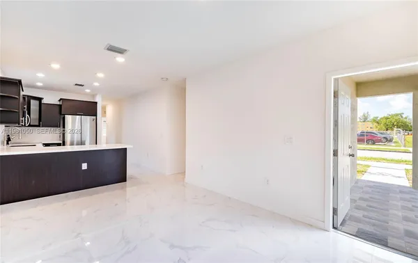 a view of workspace with furniture and window