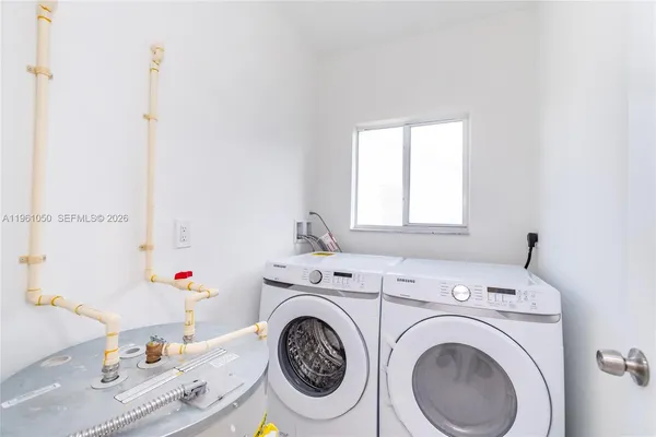 a utility room with dryer and washer
