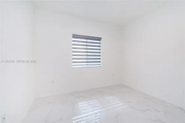 a view of a room that has a window in it