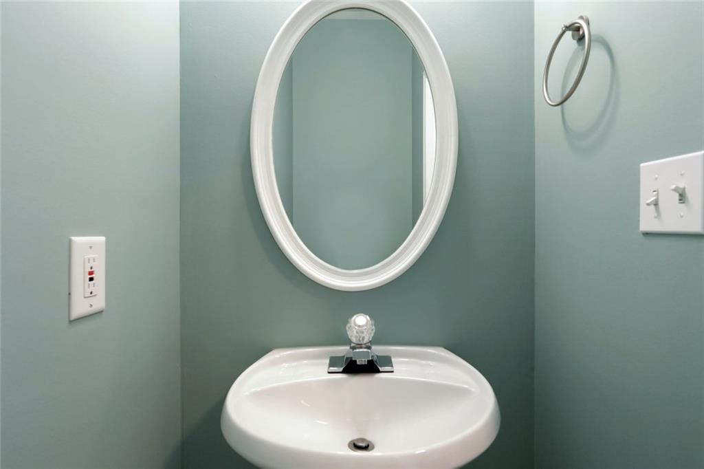 206 Spring Heights Lane, Unit 206 Smyrna, GA 30080 - Photo 12 of 29 a bathroom with a sink and mirror
