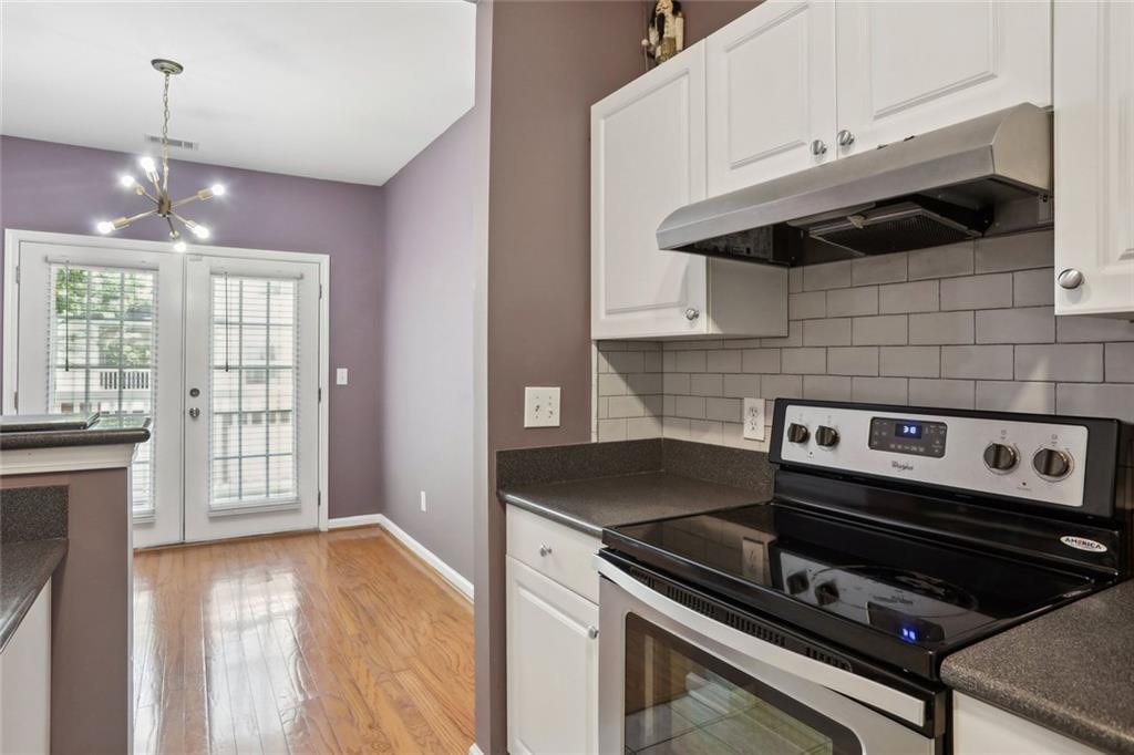 206 Spring Heights Lane, Unit 206 Smyrna, GA 30080 - Photo 17 of 29 a kitchen with a stove and a microwave