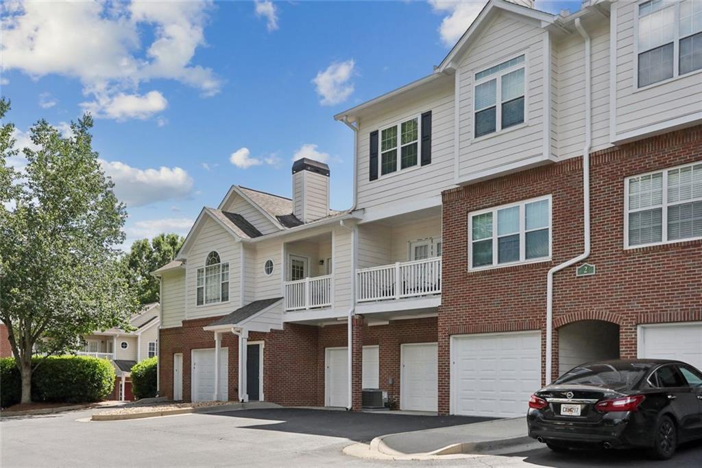 206 Spring Heights Lane, Unit 206 Smyrna, GA 30080 - Photo 2 of 29 a front view of a house with a street