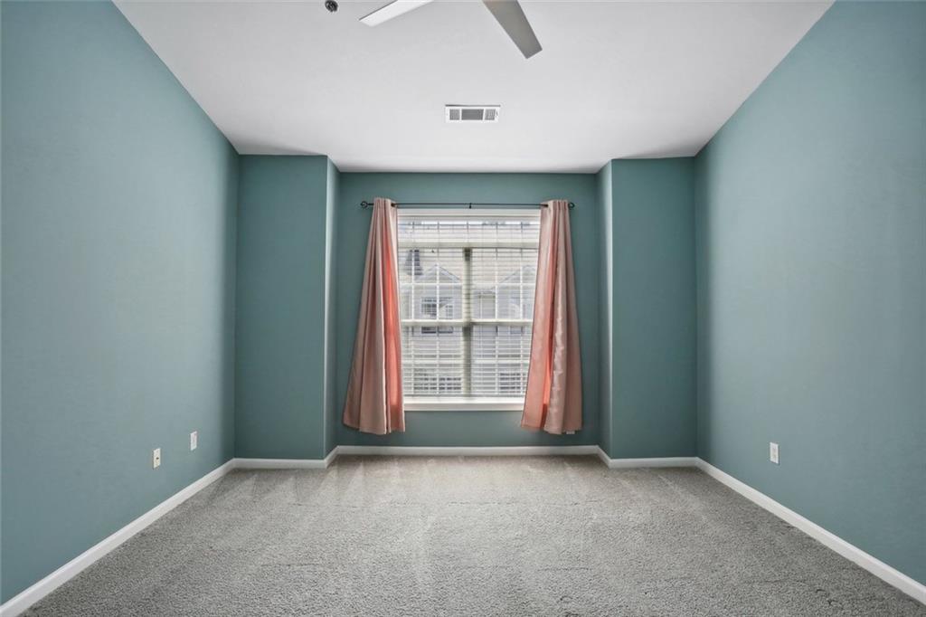 206 Spring Heights Lane, Unit 206 Smyrna, GA 30080 - Photo 21 of 29 an empty room with windows