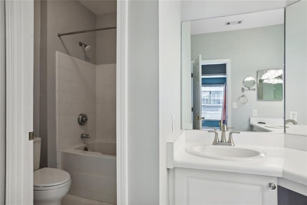 206 Spring Heights Lane, Unit 206 Smyrna, GA 30080 - Photo 22 of 29 a bathroom with a sink toilet and shower