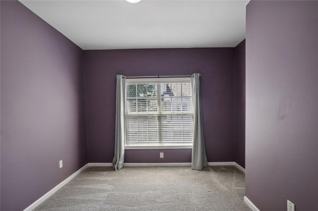 206 Spring Heights Lane, Unit 206 Smyrna, GA 30080 - Photo 25 of 29 an empty room with windows