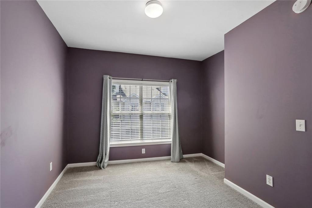 206 Spring Heights Lane, Unit 206 Smyrna, GA 30080 - Photo 26 of 29 an empty room with windows