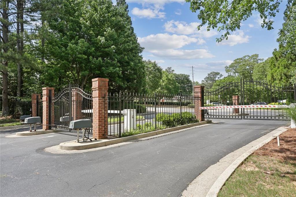 206 Spring Heights Lane, Unit 206 Smyrna, GA 30080 - Photo 3 of 29 a view of a park with a large trees