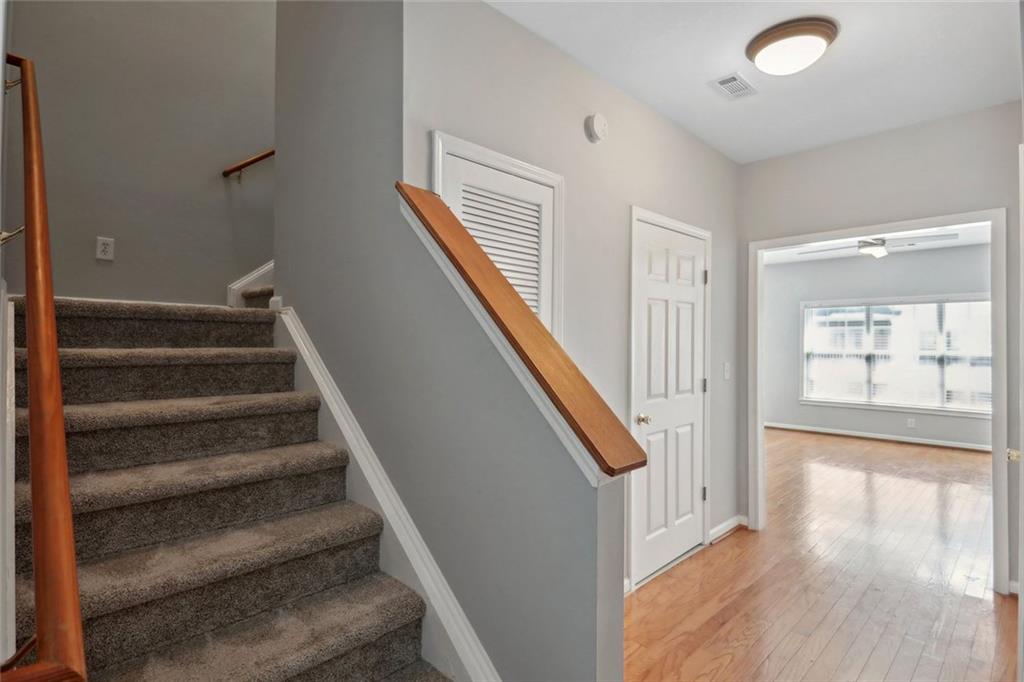 206 Spring Heights Lane, Unit 206 Smyrna, GA 30080 - Photo 7 of 29 a view of staircase with lots of frames on wall and windows