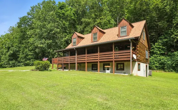 a view of an entryway with wooden floor and door