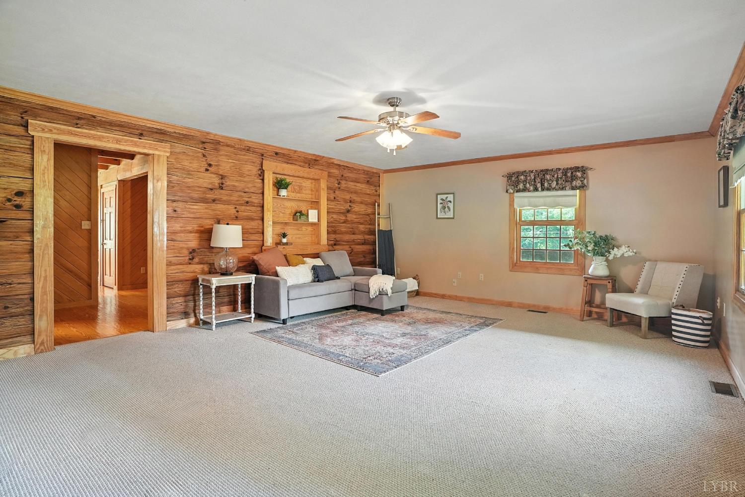 2070 Woodson Road Roseland, VA 22967 - Photo 17 of 76 a living room with furniture and a window