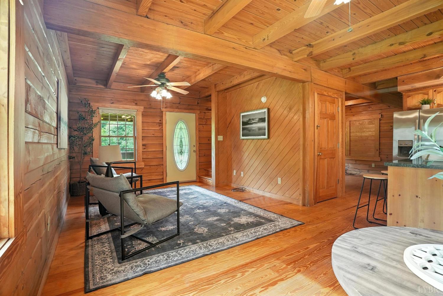 2070 Woodson Road Roseland, VA 22967 - Photo 29 of 76 a living room with furniture and a table