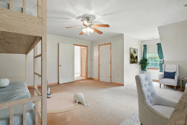 a backyard of a house with plants and large trees