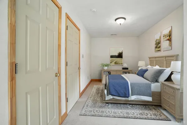 a house with a trees in the background