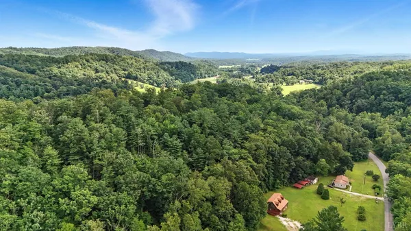 a view of a wooden deck with a yard