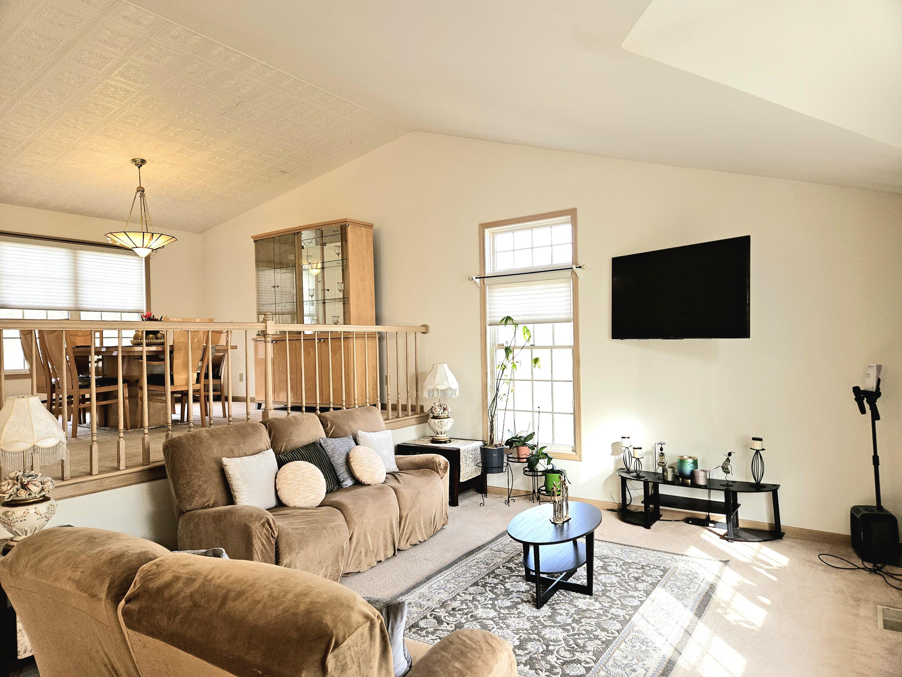 1518 West 96th Place Crown Point, IN 46307 - Photo 13 of 42 a living room with furniture and a flat screen tv