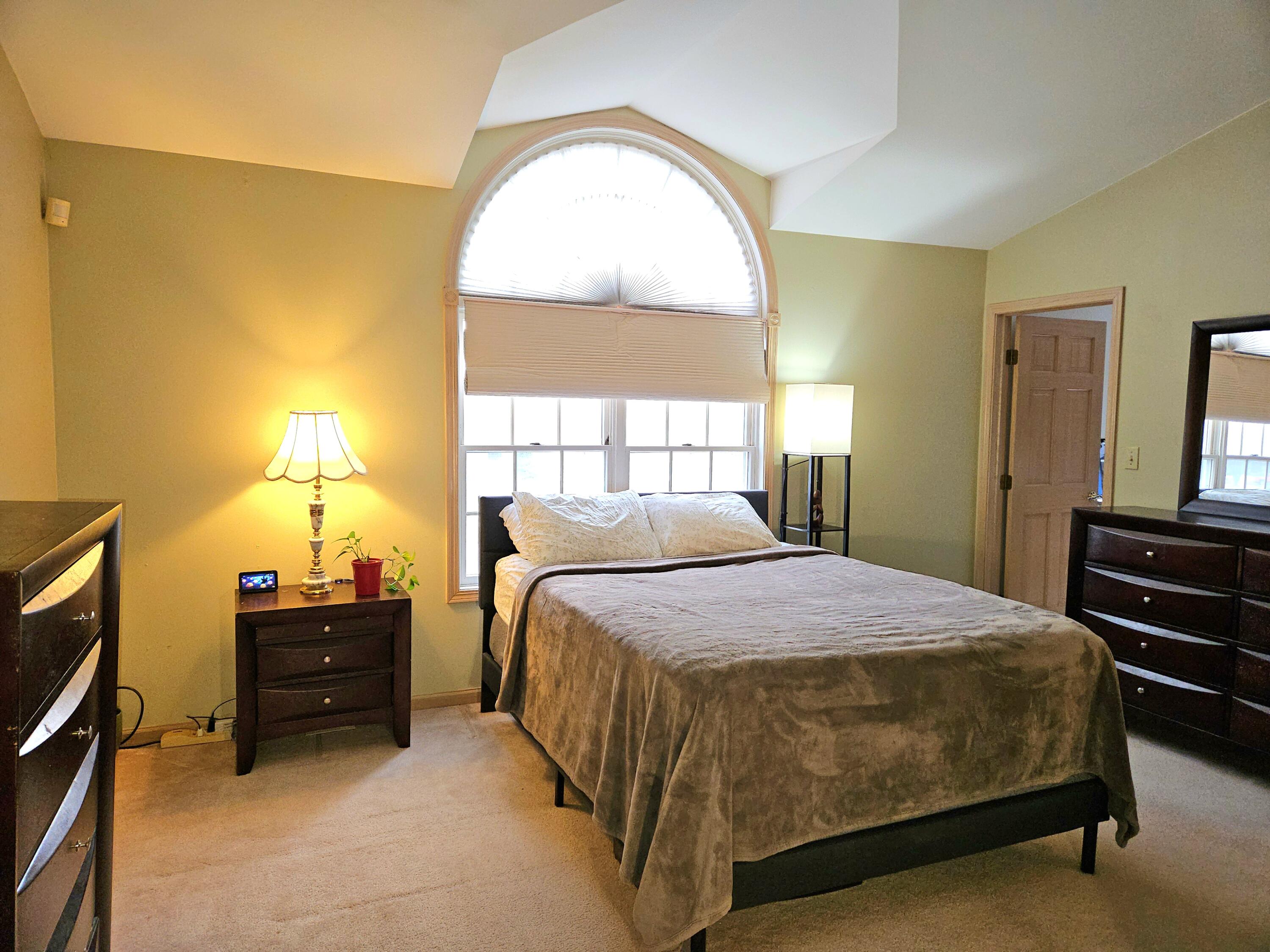 1518 West 96th Place Crown Point, IN 46307 - Photo 15 of 42 a bedroom with a bed and a window