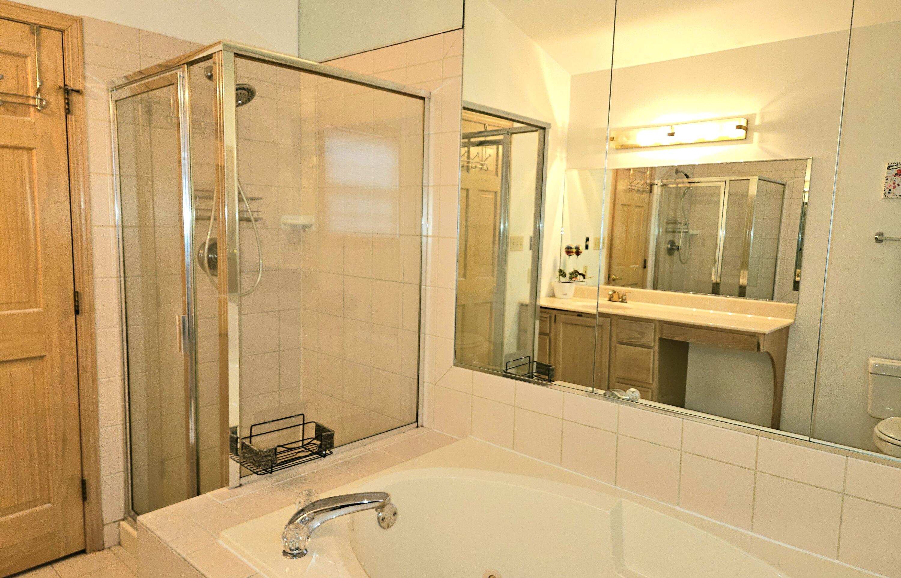 1518 West 96th Place Crown Point, IN 46307 - Photo 17 of 42 a bathroom with a tub and shower