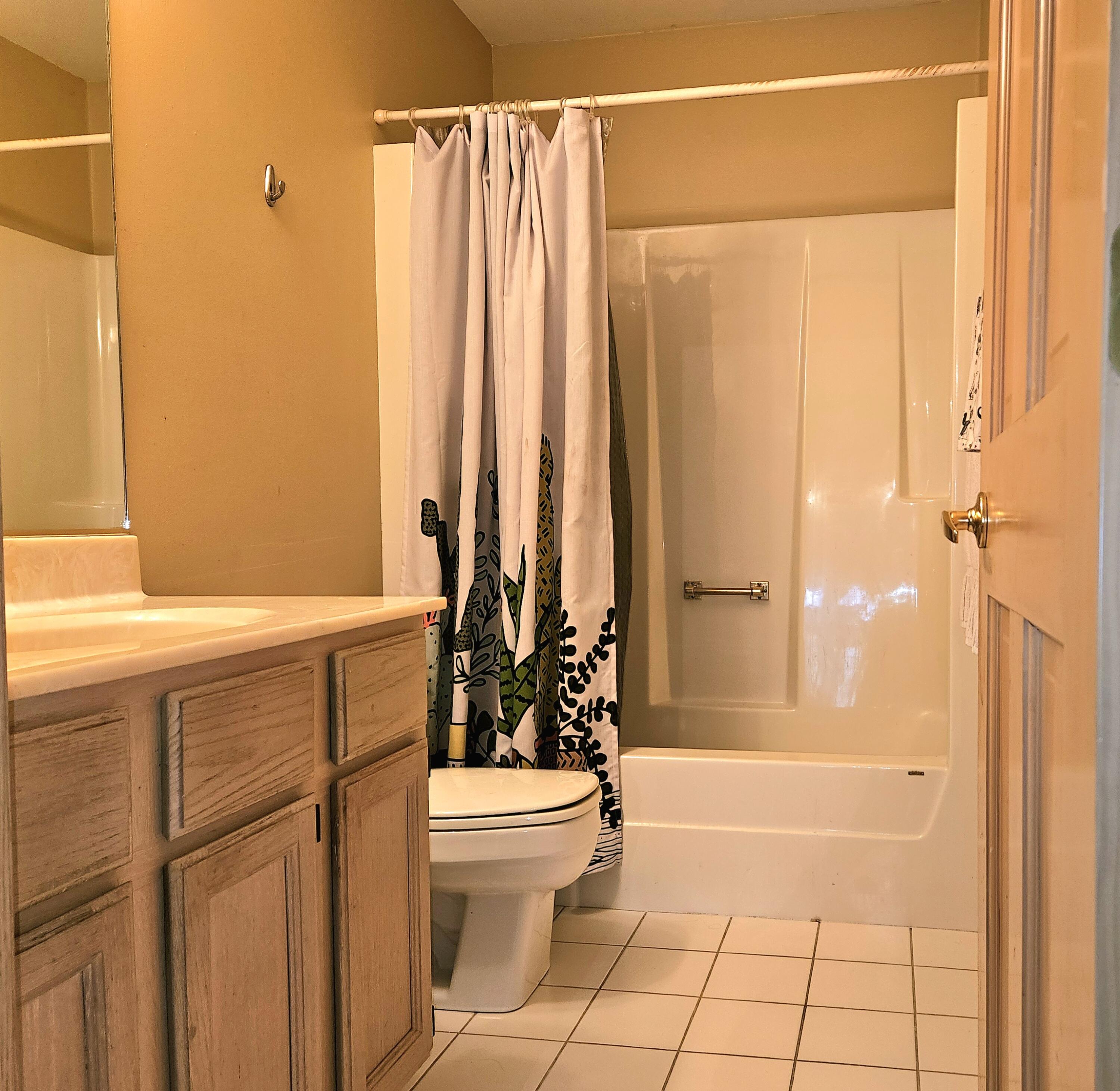 1518 West 96th Place Crown Point, IN 46307 - Photo 20 of 42 a bathroom with a bathtub and a shower