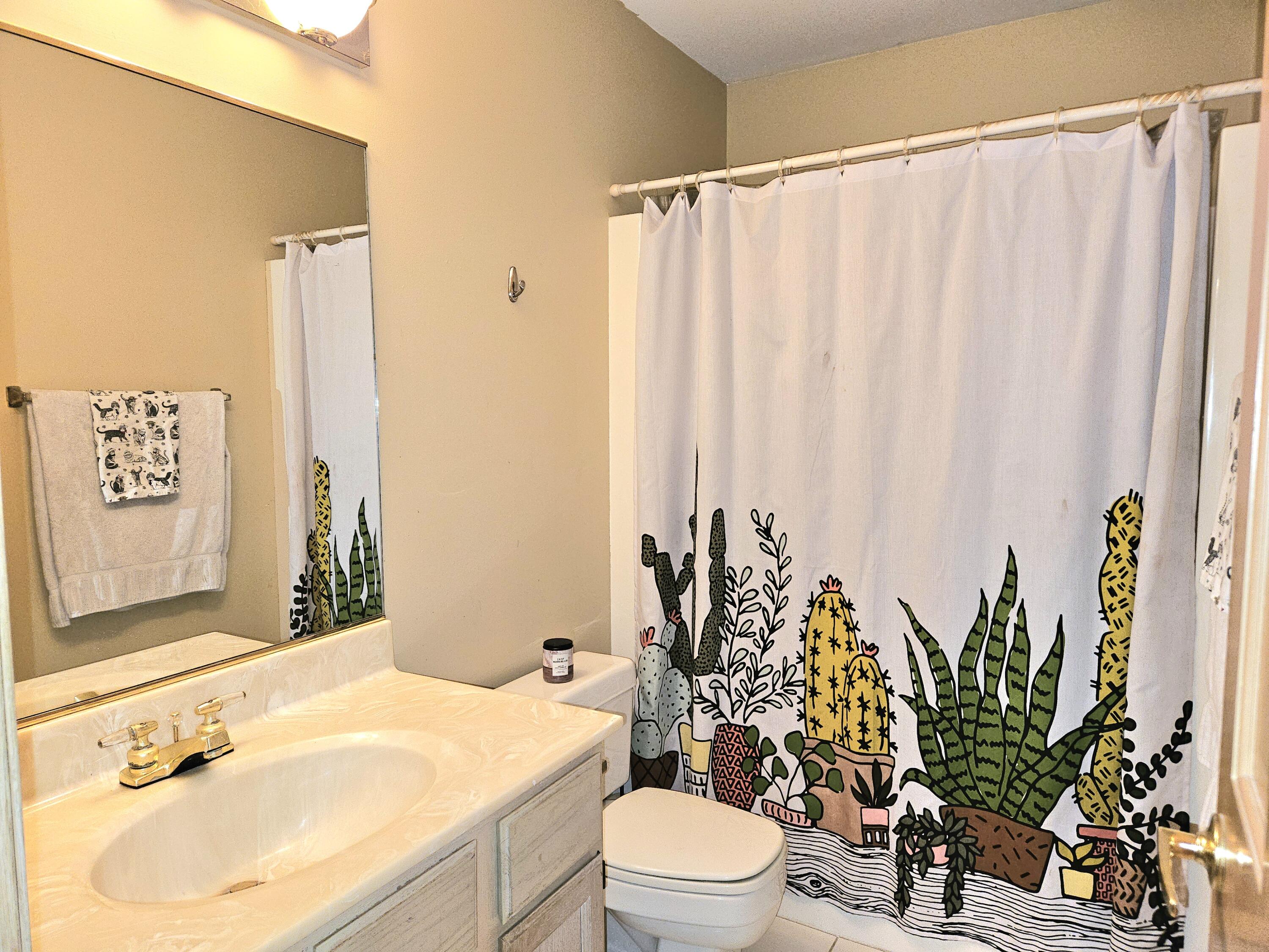 1518 West 96th Place Crown Point, IN 46307 - Photo 21 of 42 a bathroom with a sink a mirror and a toilet