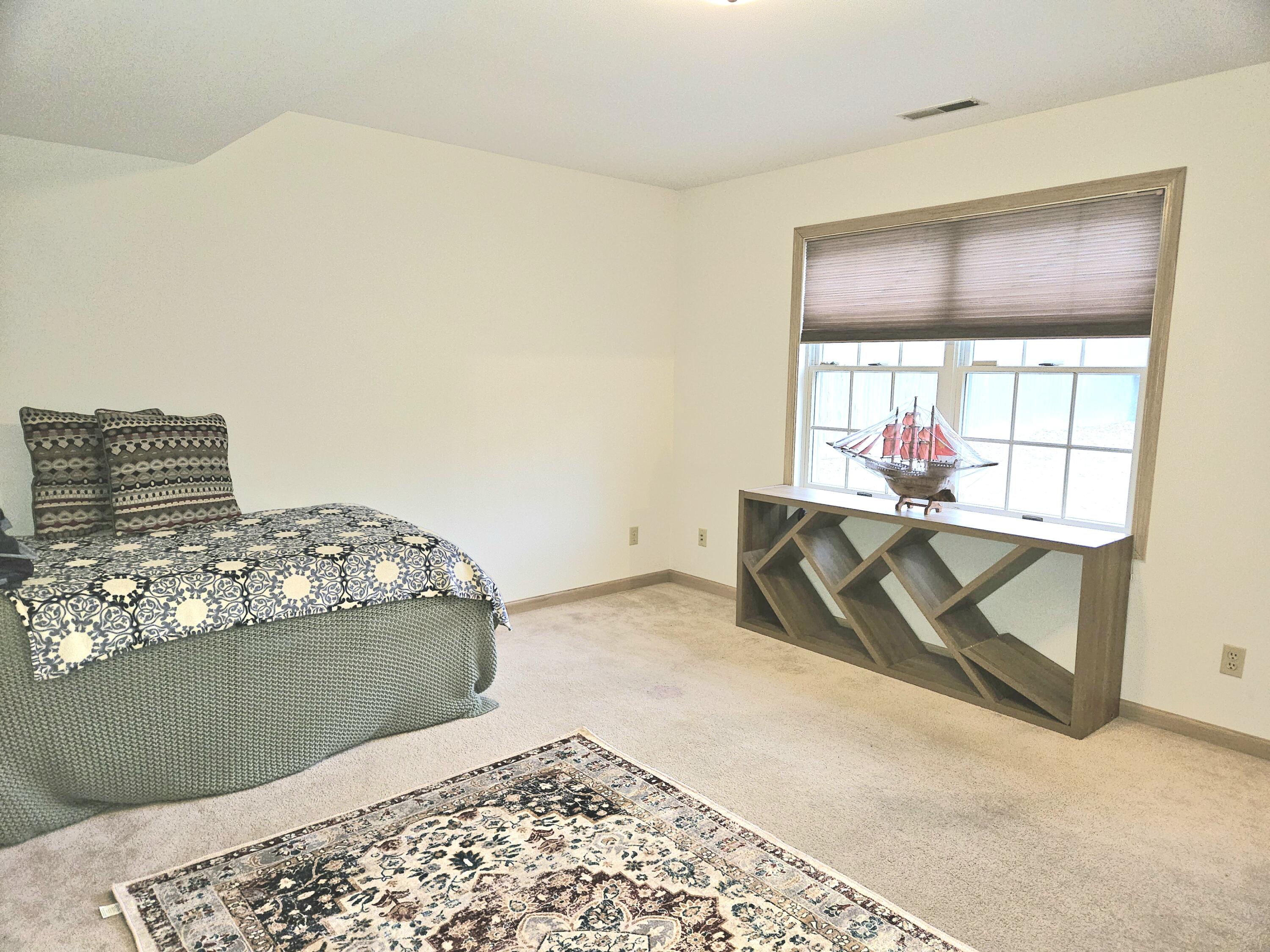 1518 West 96th Place Crown Point, IN 46307 - Photo 29 of 42 a bedroom with a bed and window