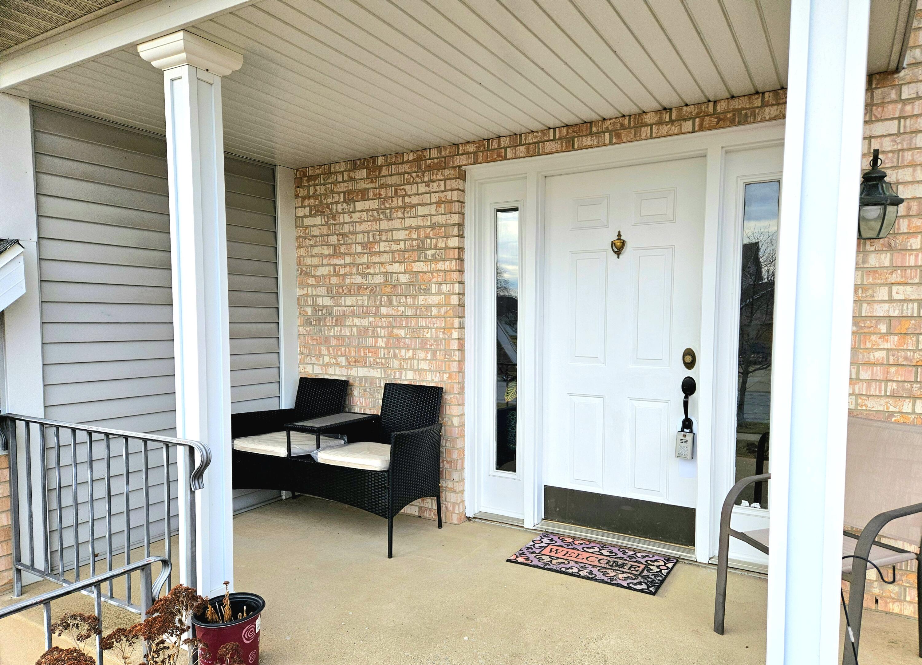 1518 West 96th Place Crown Point, IN 46307 - Photo 3 of 42 a balcony with furniture and a table