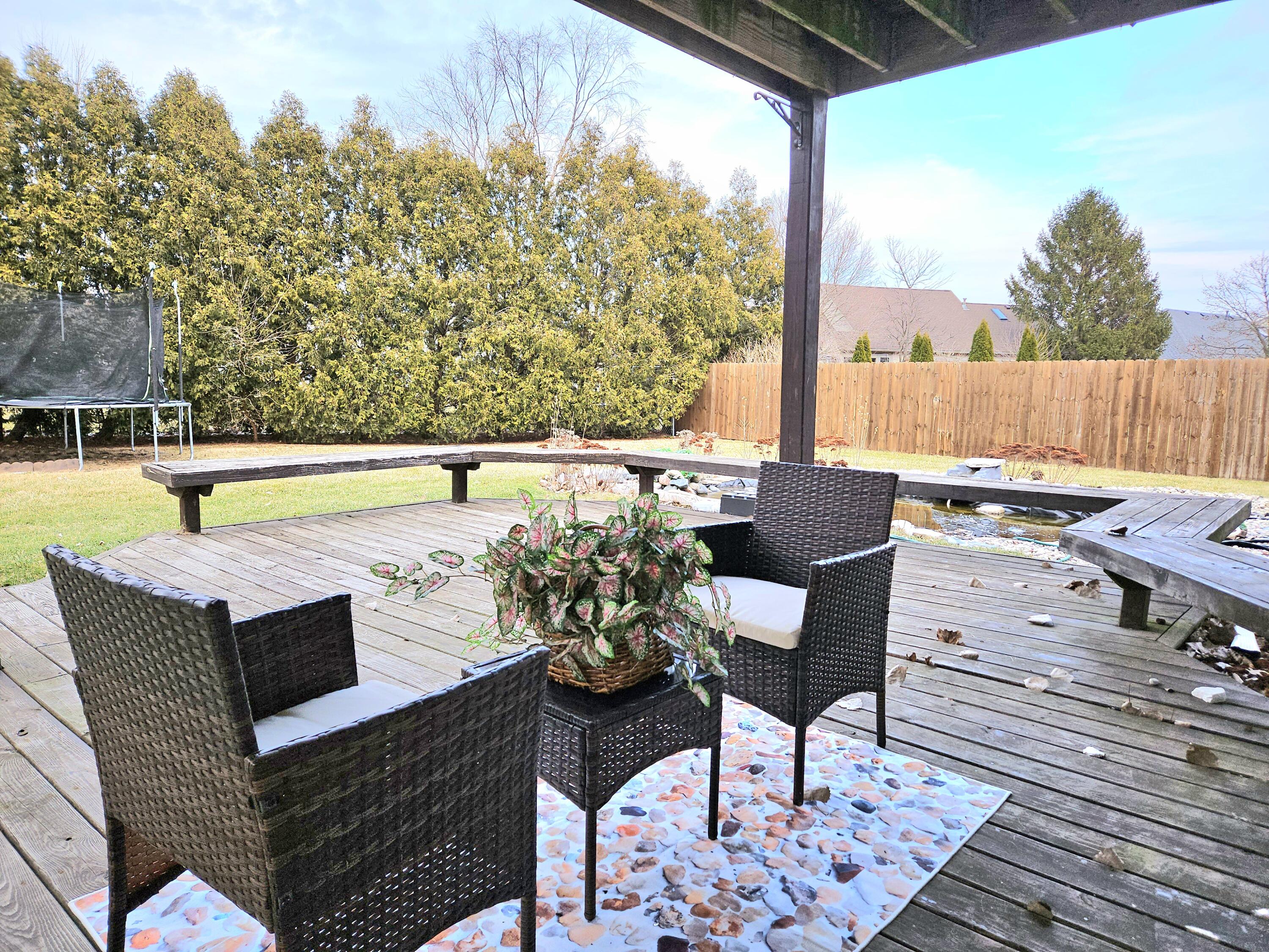1518 West 96th Place Crown Point, IN 46307 - Photo 33 of 42 a view of a chairs and table in the patio with a swimming pool