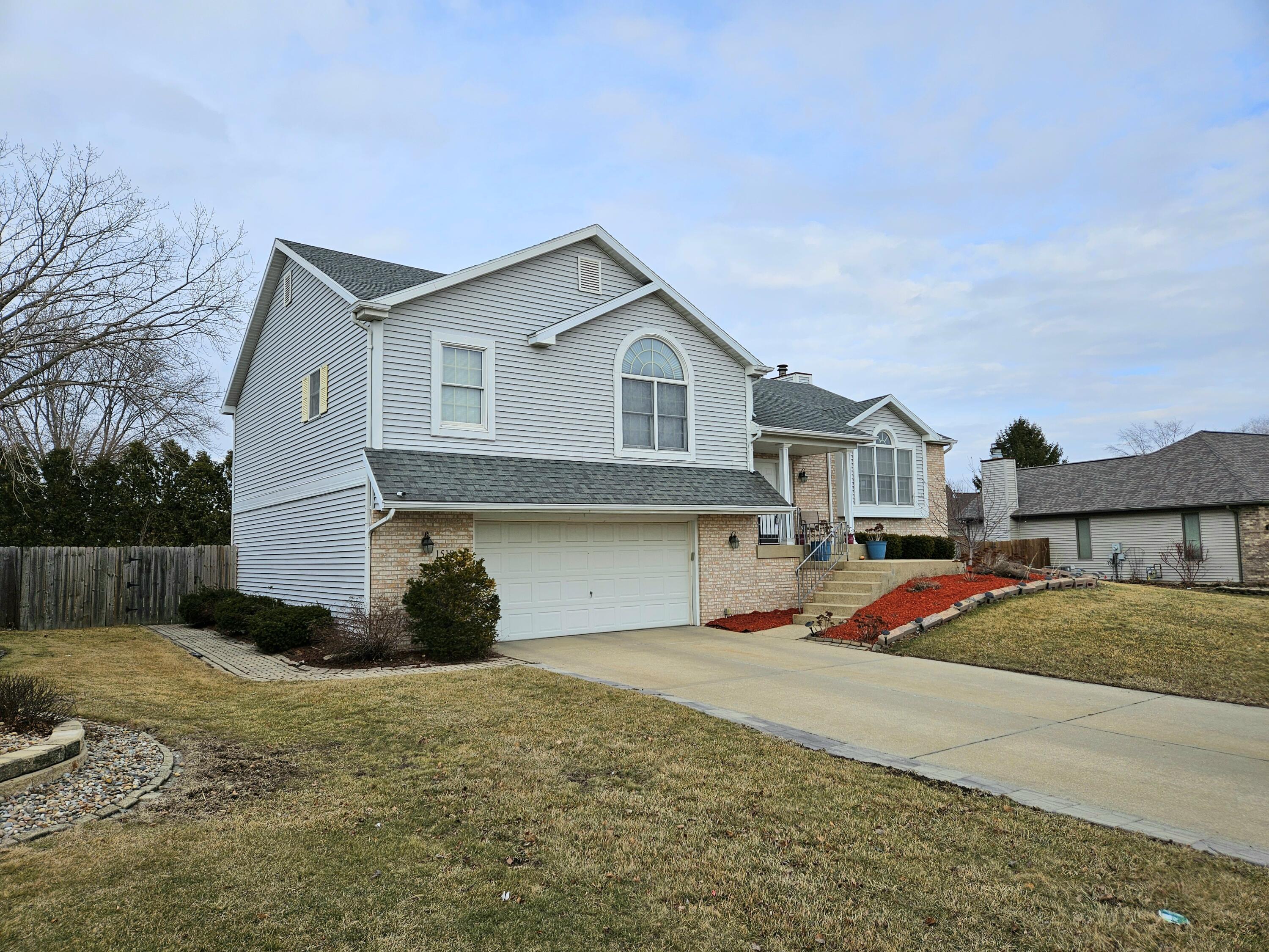 1518 West 96th Place Crown Point, IN 46307 - Photo 40 of 42 a front view of a house with a yard