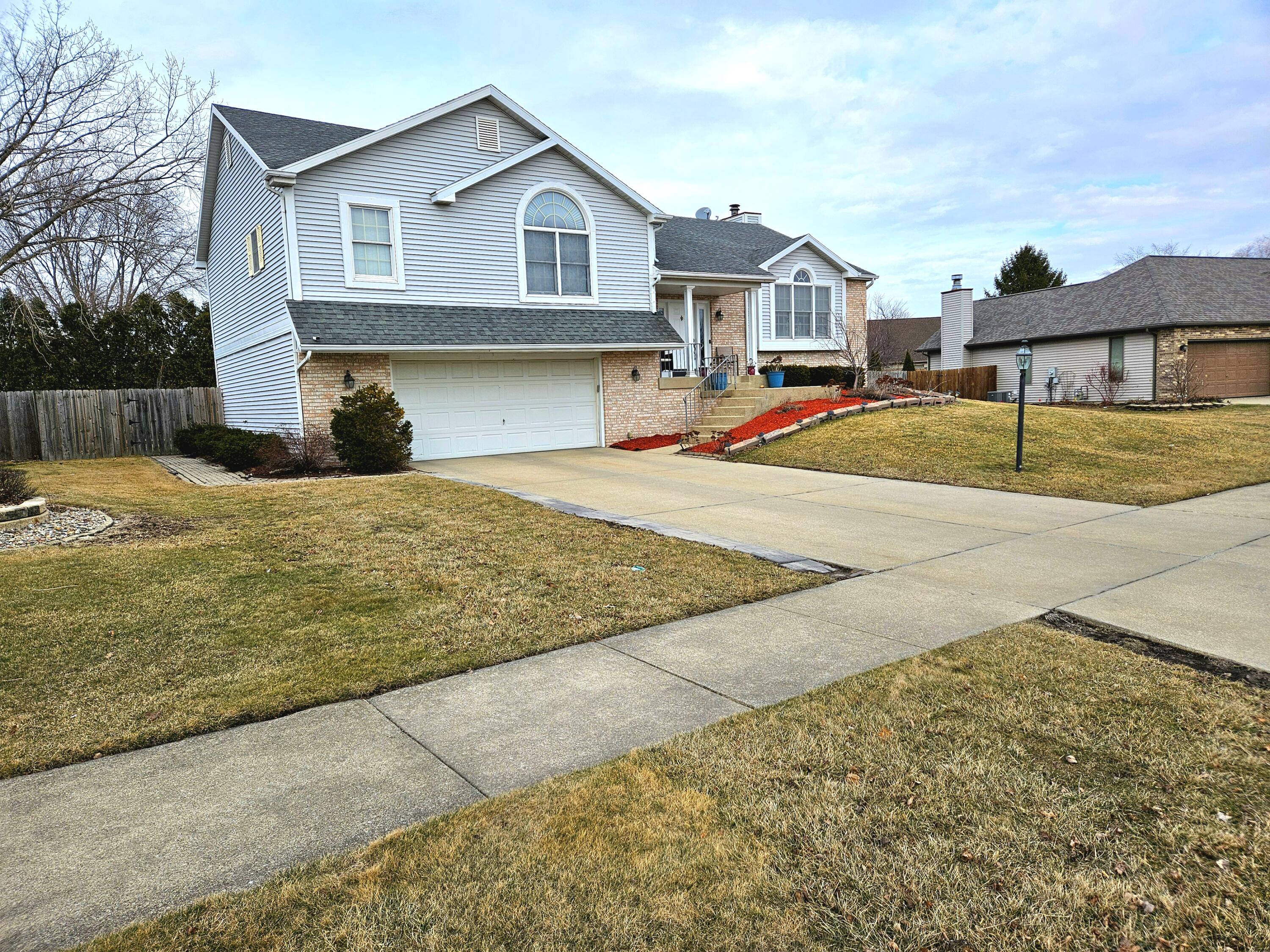 1518 West 96th Place Crown Point, IN 46307 - Photo 41 of 42 a front view of a house with a yard