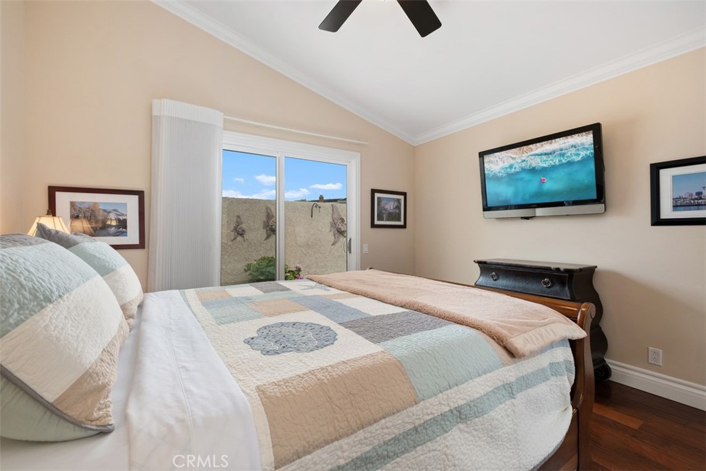 31202 Palma Drive Laguna Niguel, CA 92677 - Photo 31 of 47 a bedroom with a bed and a painting on the wall