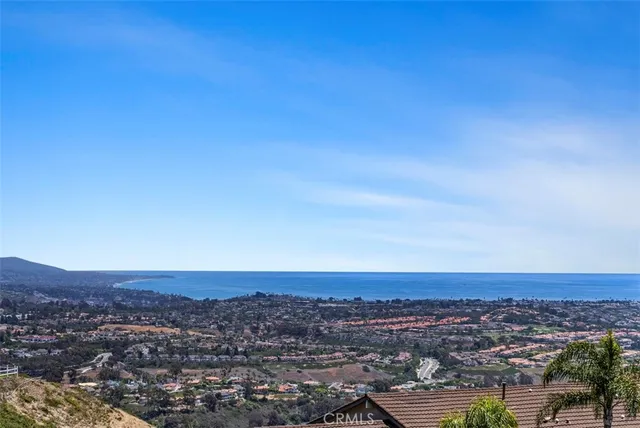 an aerial view of residential building and trees around