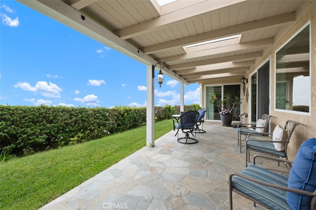 31202 Palma Drive Laguna Niguel, CA 92677 - Photo 35 of 47 a view of a chair and tables in the patio
