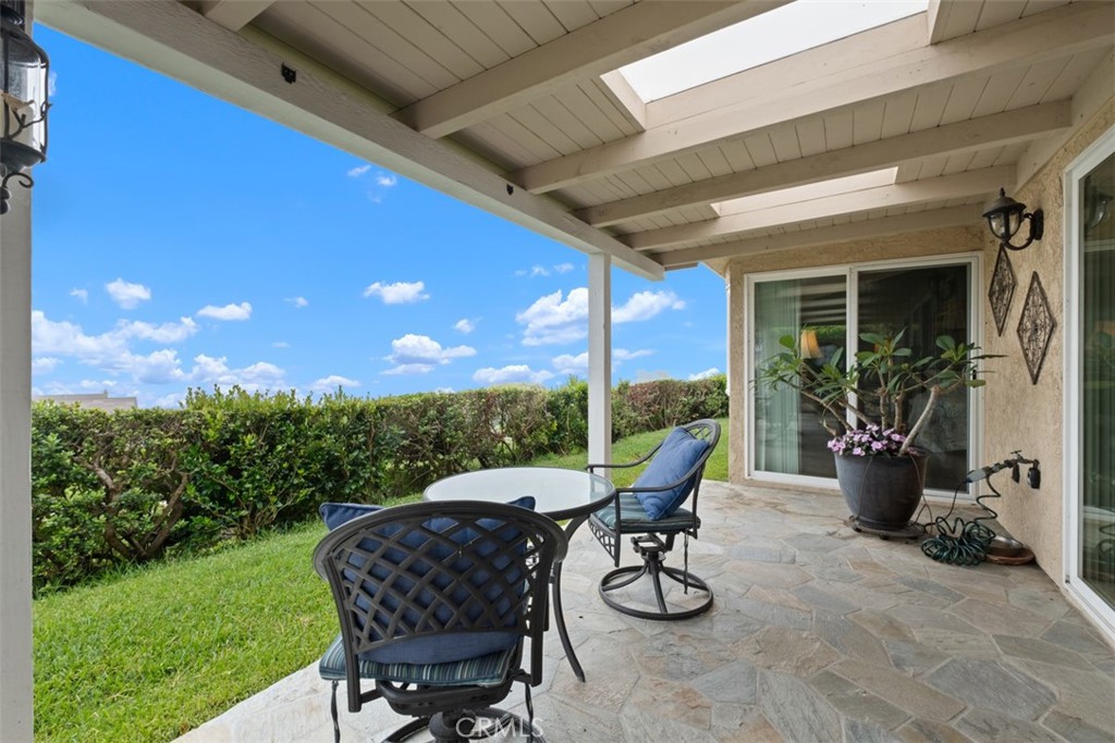 31202 Palma Drive Laguna Niguel, CA 92677 - Photo 36 of 47 a view of a patio with a dining table and chairs
