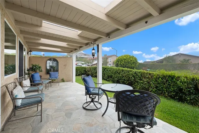 a view of a patio with a table chairs and a table
