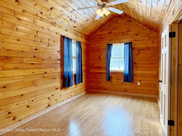 front view of a brick house with a large window